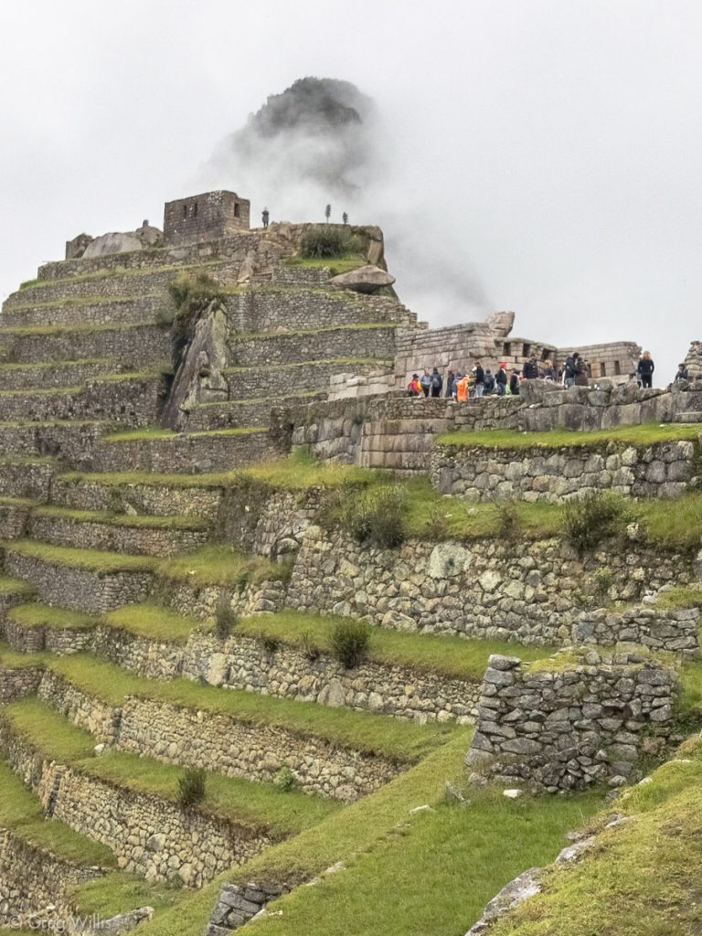 Intiwatana Pyramid and Wayna Picchu in back
