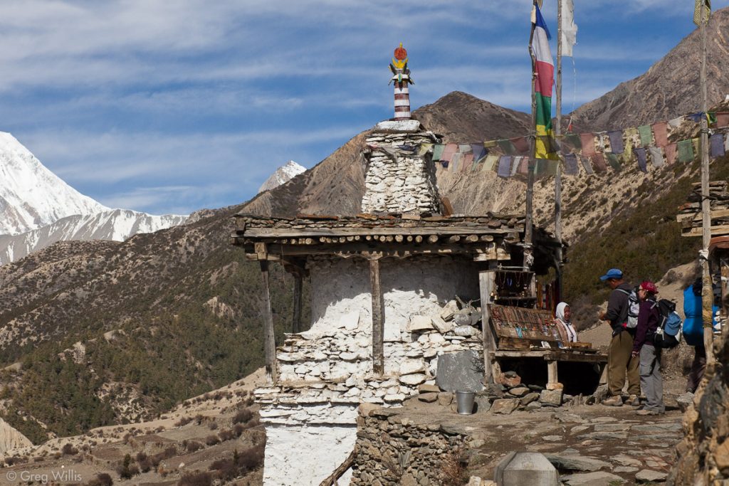 Woman selling items at a chorten