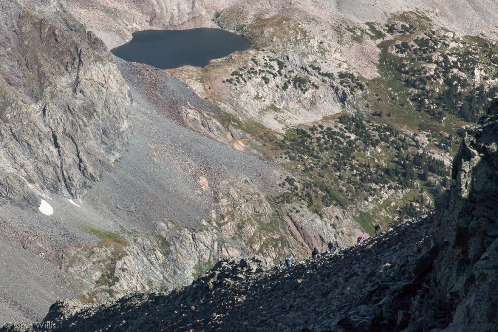 Climbers on the Blanca North Ridge with Lily Lake in Back